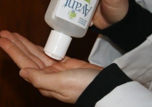 Applying alcohol-free hand sanitizer to hands