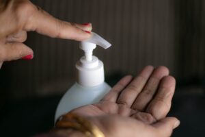 Applying hand sanitizer